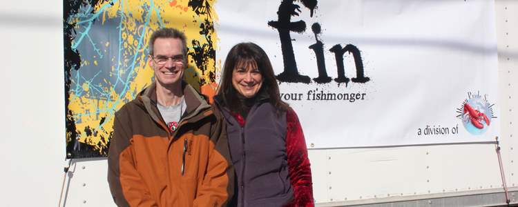 fin founders standing in front of van