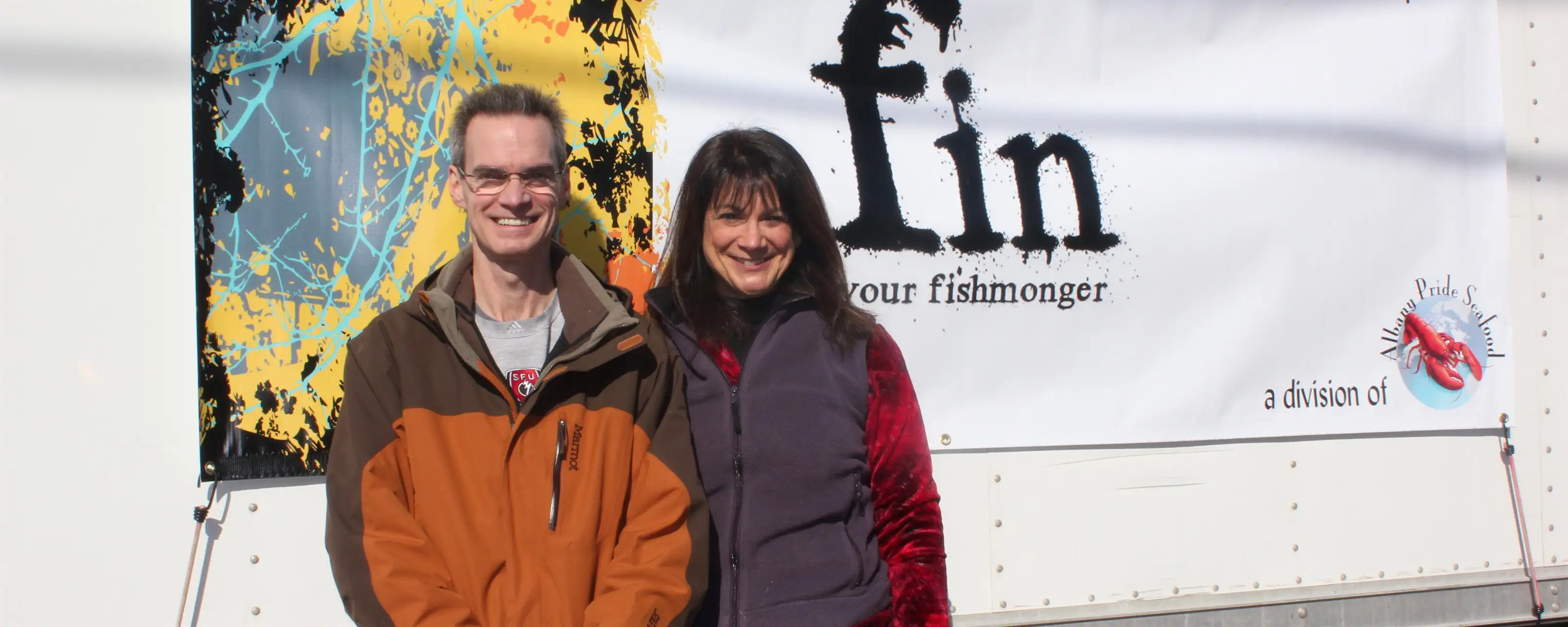 fin founders standing in front of van