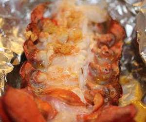 Wrap our lobster tails loosely in foil after adding garlic butter & grill or bake for 12 mins small or 22 mins large.